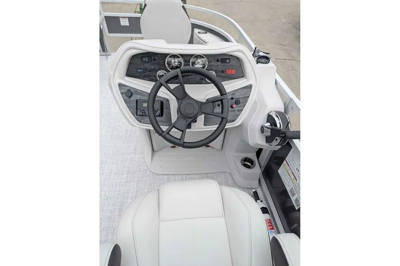 Slide: The Image of 2025 South Bay 16FC SE S Entertainment boat helm with modern controls and steering wheel. - 14