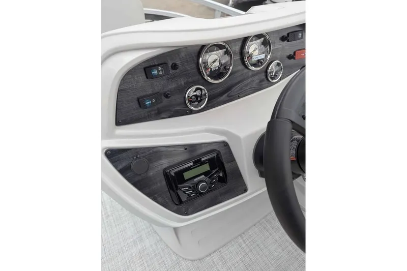 Slide: The Image of Dashboard of 2025 South Bay 16FC SE S Entertainment boat with gauges and controls. - 15