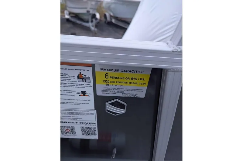 Slide: The Image of 2025 South Bay 16FC SE S Entertainment boat capacity label, 6 persons or 915 lbs. - 17