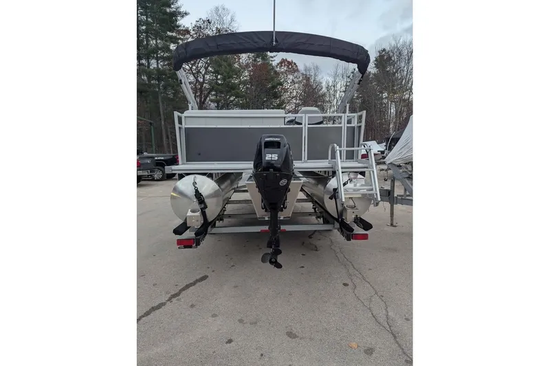 Slide: The Image of 2025 South Bay 16FC SE S Entertainment pontoon boat with 25HP motor, parked outdoors. - 3