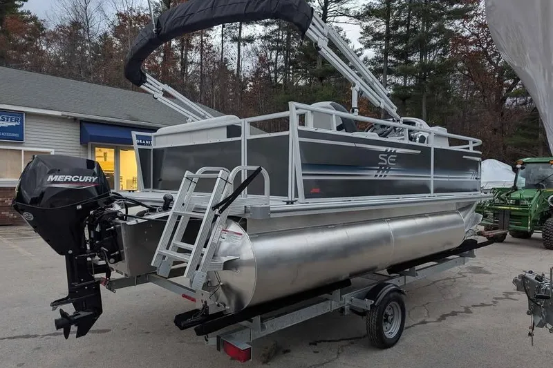 Slide: The Image of 2025 South Bay 16FC SE S Entertainment pontoon boat with Mercury outboard motor. - 4
