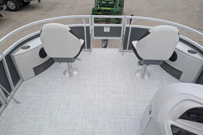 Slide: The Image of 2025 South Bay 16FC SE S Entertainment pontoon boat interior with seating and speakers. - 9