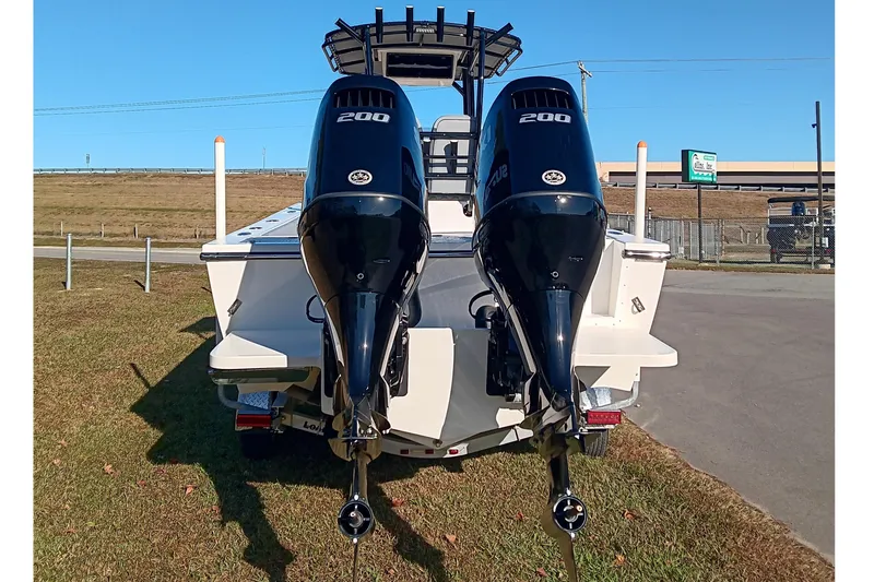 Slide: The Image of 2026 May-Craft 245 Offshore CC boat with dual 200 horsepower engines, rear view. - 4