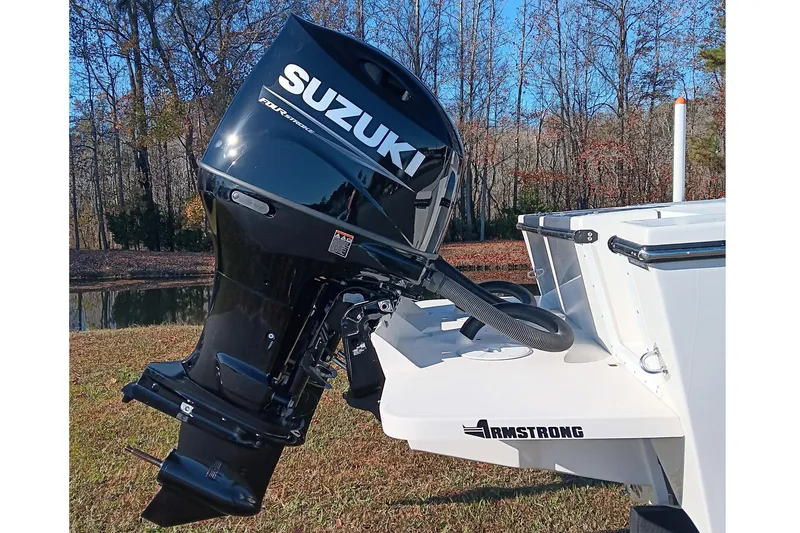 Slide: The Image of 2026 May-Craft 245 Offshore CC with Suzuki outboard motor, displayed outdoors. - 5