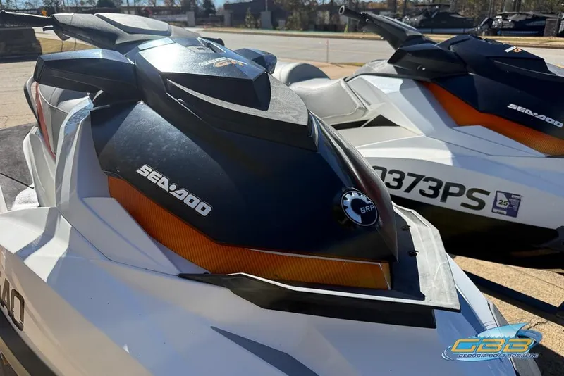 Slide: The Image of 2011 Sea-Doo GTI 130 jet skis parked outdoors, showcasing sleek design and branding. - 8