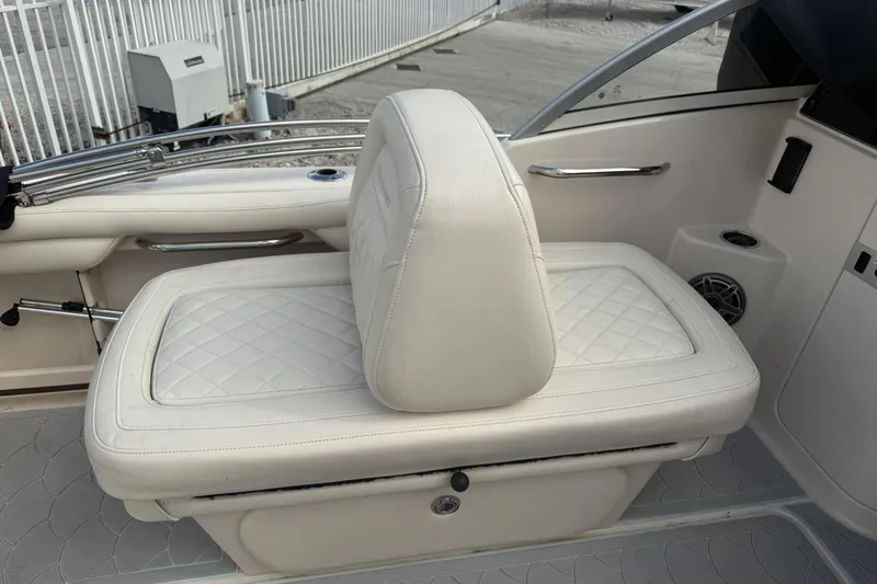 Slide: The Image of 2023 Grady-White Freedom 215 boat interior with white cushioned seating. - 18