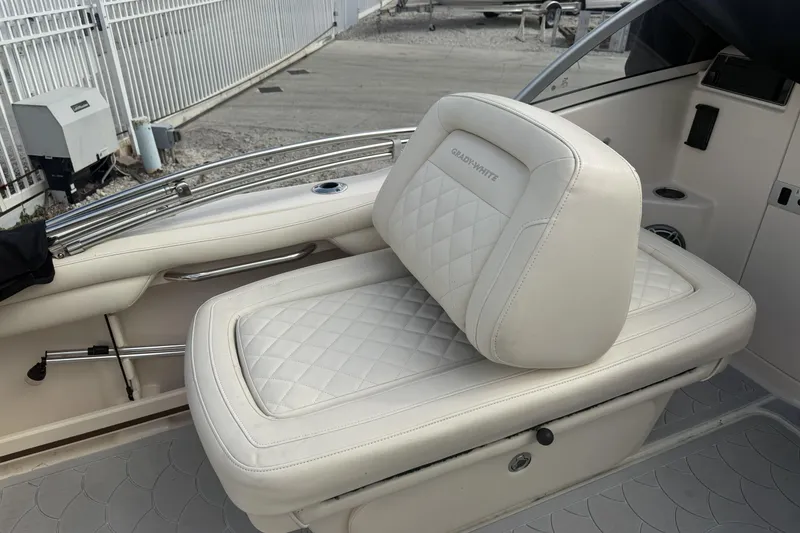 Slide: The Image of 2023 Grady-White Freedom 215 boat seat with quilted white upholstery. - 19