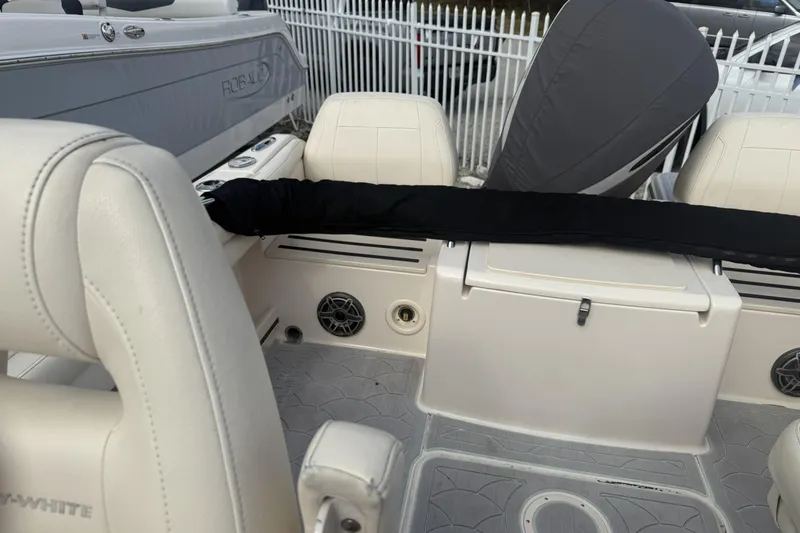 Slide: The Image of 2023 Grady-White Freedom 215 boat interior with seating and covered engine. - 20