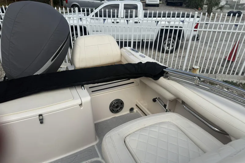 Slide: The Image of 2023 Grady-White Freedom 215 boat interior with seating and engine cover. - 21