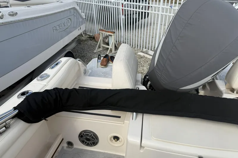 Slide: The Image of 2023 Grady-White Freedom 215 boat interior with covered engine and seating. - 23
