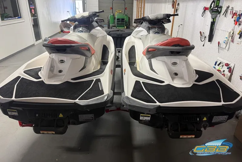 Slide: The Image of Two 2012 Sea-Doo GTI 130 jet skis in a garage setting. - 13
