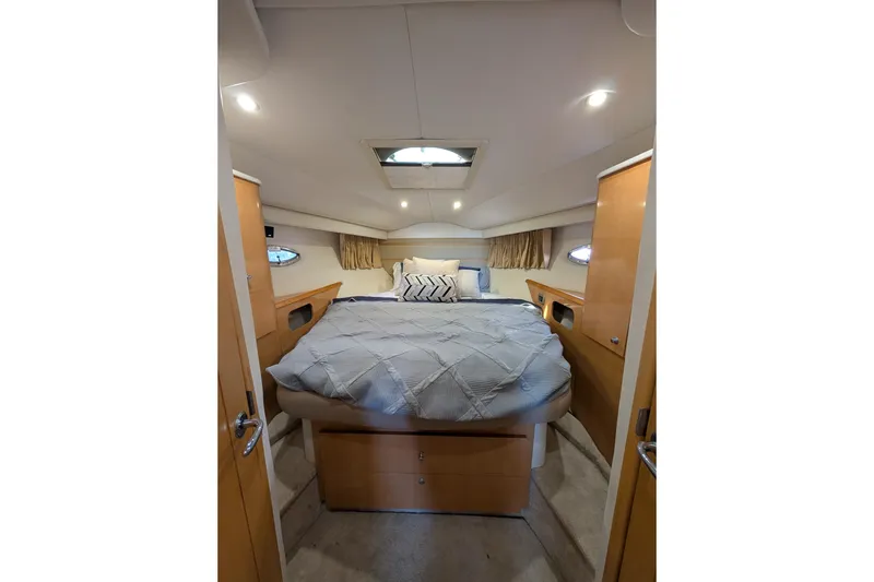 Slide: The Image of Luxurious cabin interior of 2009 Four Winns V458 yacht with cozy bed and modern design. - 12