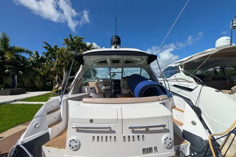 Slide: The Image of 2009 Four Winns V458 yacht docked under clear blue sky. - 3