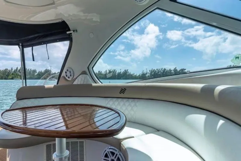 Slide: The Image of Luxurious interior of 2009 Four Winns V458 yacht with elegant seating and wooden table. - 6