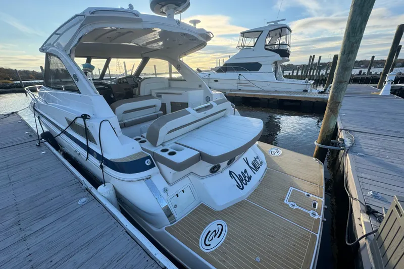 Slide: The Image of 2017 Regal 35 Sport Coupe docked at marina, showcasing sleek design and spacious deck. - 18