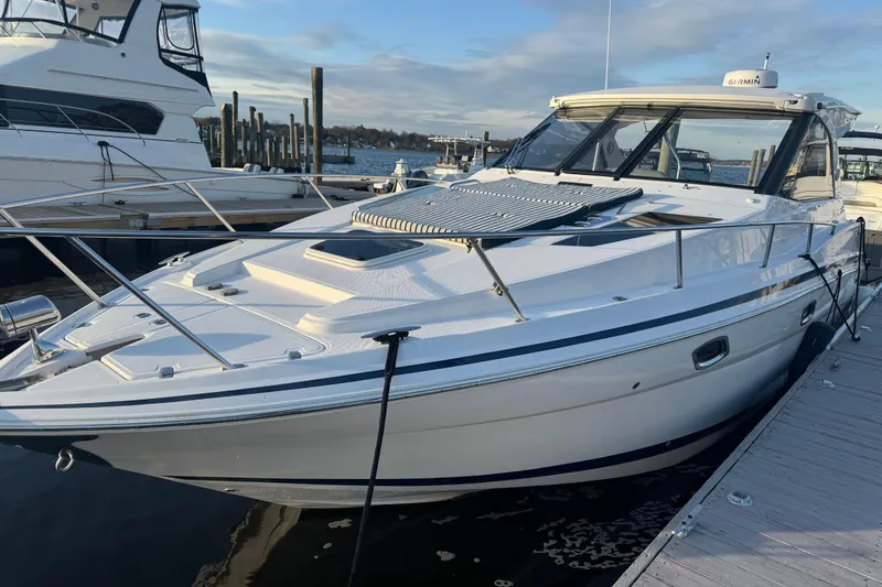 Slide: The Image of 2017 Regal 35 Sport Coupe docked at marina, showcasing sleek design and modern features. - 2