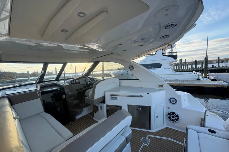 Slide: The Image of Interior view of a 2017 Regal 35 Sport Coupe yacht at a marina. - 8