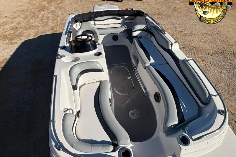 Slide: The Image of 2014 Starcraft 2000 IO Limited boat interior with seating and steering wheel. - 5