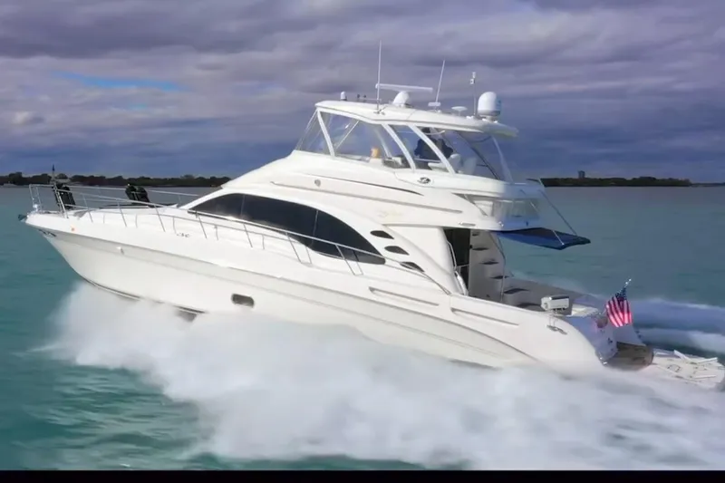 The Image of 2007 Sea Ray 58 Sedan Bridge yacht cruising on open water. - 0