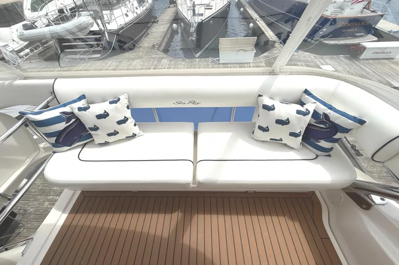 Slide: The Image of Luxurious 2007 Sea Ray 58 Sedan Bridge yacht with stylish seating and nautical-themed cushions. - 18