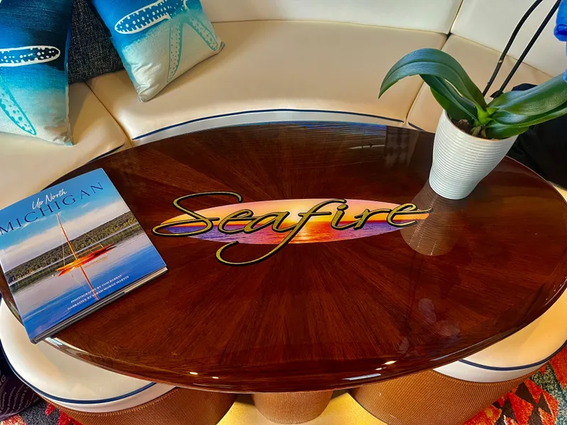 Slide: The Image of Luxurious interior of 2007 Sea Ray 58 Sedan Bridge with elegant table and decor. - 21