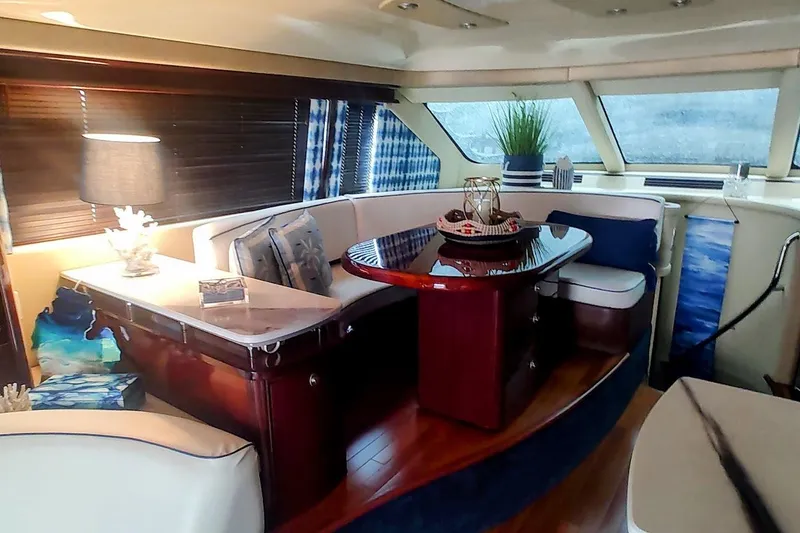 Slide: The Image of Luxurious interior of 2007 Sea Ray 58 Sedan Bridge yacht with elegant seating and decor. - 26
