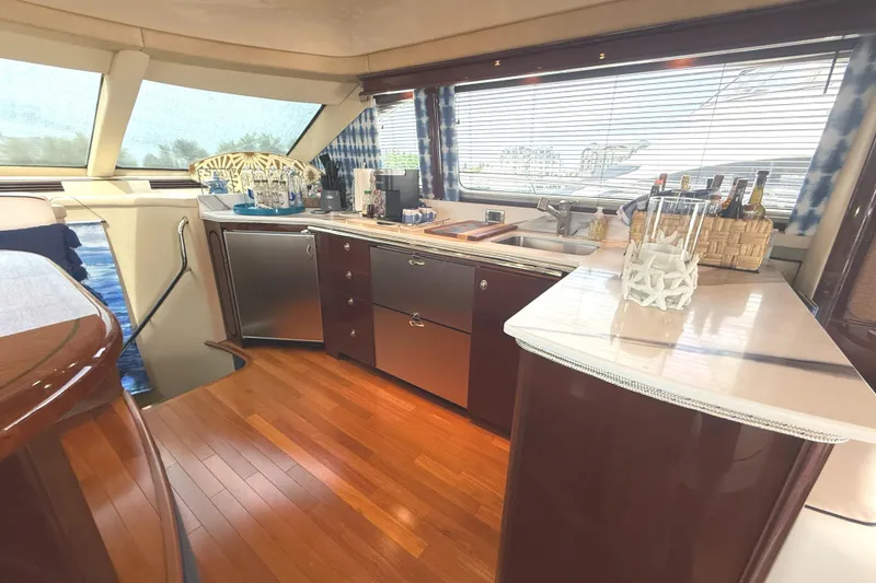 Slide: The Image of Luxurious interior of 2007 Sea Ray 58 Sedan Bridge yacht with elegant kitchen design. - 27