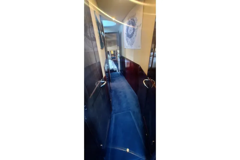 Slide: The Image of Interior hallway of 2007 Sea Ray 58 Sedan Bridge yacht with blue carpet. - 30