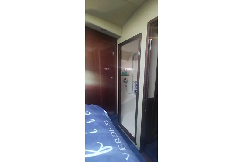 Slide: The Image of Interior of 2007 Sea Ray 58 Sedan Bridge yacht, featuring a compact shower area. - 41