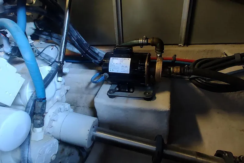 Slide: The Image of Engine compartment of 2007 Sea Ray 58 Sedan Bridge, featuring mechanical components and wiring. - 48