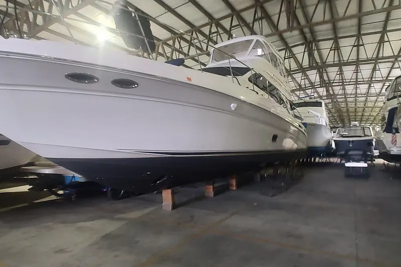 Slide: The Image of 2007 Sea Ray 58 Sedan Bridge yacht in indoor storage facility. - 6