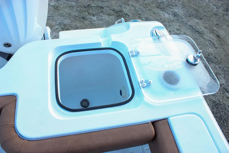 Slide: The Image of 2026 Sea Hunt Gamefish 28 Forward Seating livewell with transparent lid and brown seating. - 11
