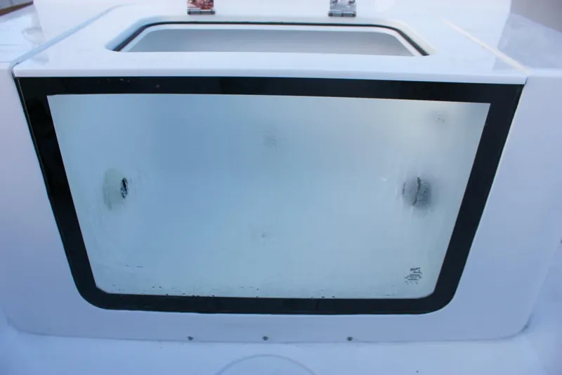 Slide: The Image of 2026 Sea Hunt Gamefish 28 Forward Seating livewell with transparent viewing window. - 16