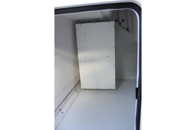 Slide: The Image of Storage compartment inside 2026 Sea Hunt Gamefish 28 Forward Seating boat. - 19