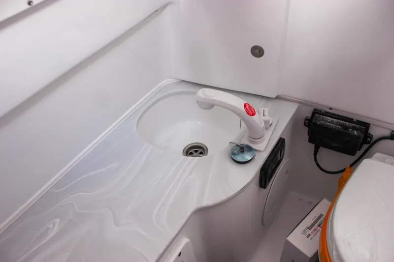 Slide: The Image of 2026 Sea Hunt Gamefish 28 Forward Seating boat interior sink and faucet. - 22