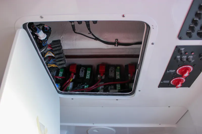 Slide: The Image of Battery compartment of 2026 Sea Hunt Gamefish 28 Forward Seating boat. - 26