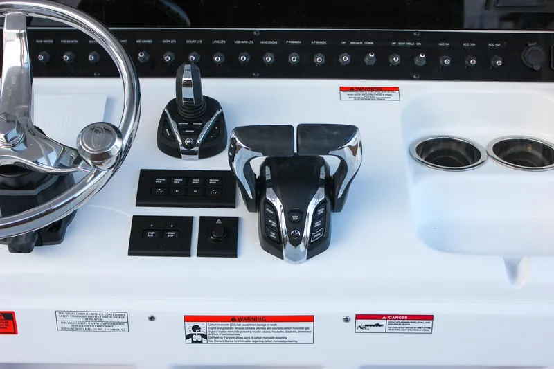 Slide: The Image of Control panel of 2026 Sea Hunt Gamefish 28 Forward Seating boat with steering wheel. - 34