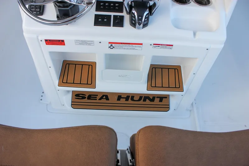 Slide: The Image of 2026 Sea Hunt Gamefish 28 Forward Seating console with controls and branding. - 36