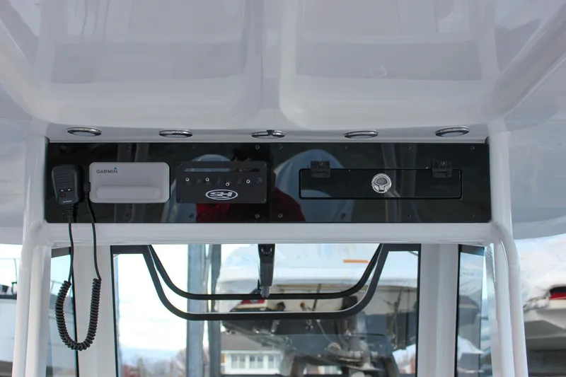 Slide: The Image of 2026 Sea Hunt Gamefish 28 console with Garmin electronics and storage compartments. - 38