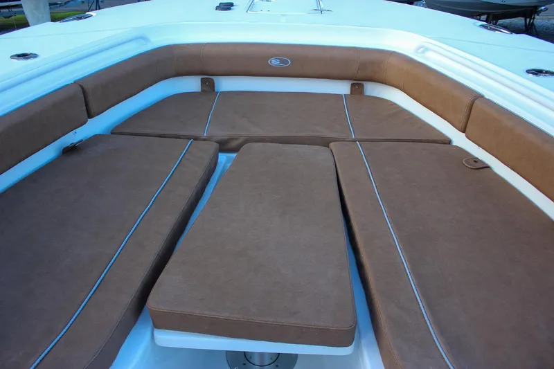 Slide: The Image of 2026 Sea Hunt Gamefish 28 Forward Seating with brown cushioned seats. - 45