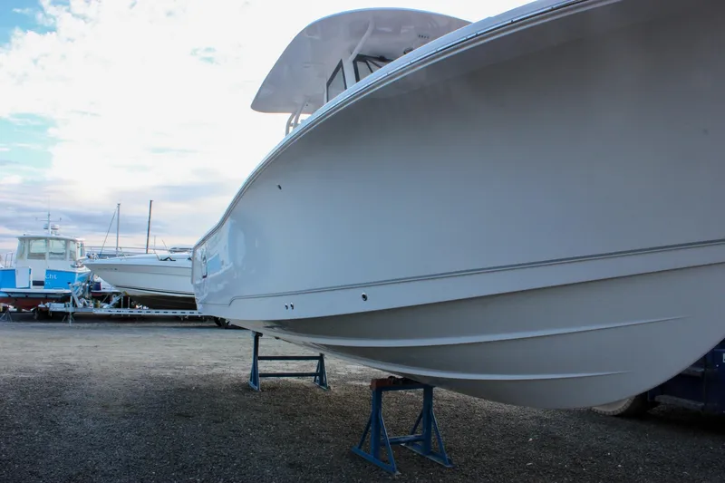 Slide: The Image of 2026 Sea Hunt Gamefish 28 Forward Seating boat on display, side view. - 5