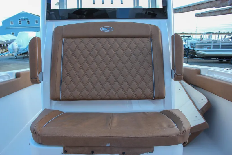 Slide: The Image of 2026 Sea Hunt Gamefish 28 Forward Seating with brown diamond-stitched upholstery. - 56