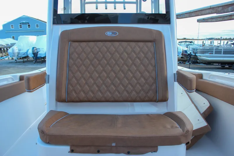 Slide: The Image of 2026 Sea Hunt Gamefish 28 Forward Seating with brown diamond-stitched upholstery. - 57