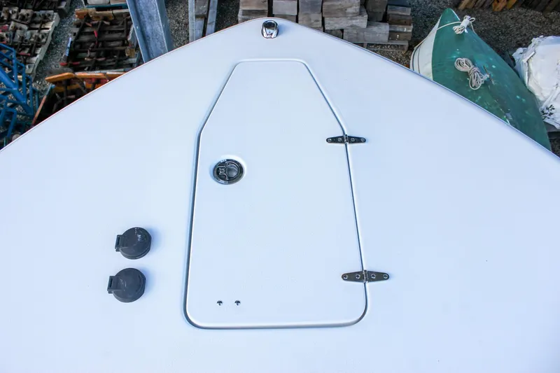 Slide: The Image of Bow deck of 2026 Sea Hunt Gamefish 28 Forward Seating boat, featuring storage hatch. - 59