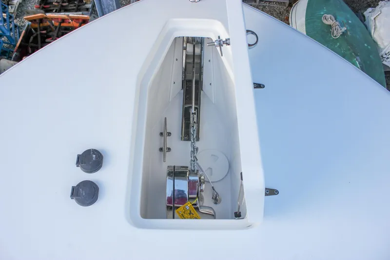 Slide: The Image of 2026 Sea Hunt Gamefish 28 anchor compartment with chain and winch system. - 60