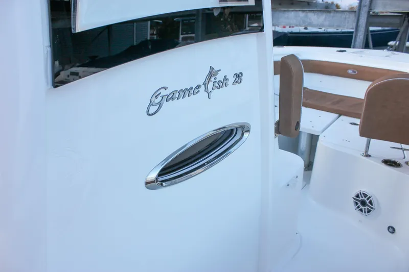 Slide: The Image of 2026 Sea Hunt Gamefish 28 Forward Seating boat interior with sleek design and comfortable seating. - 64