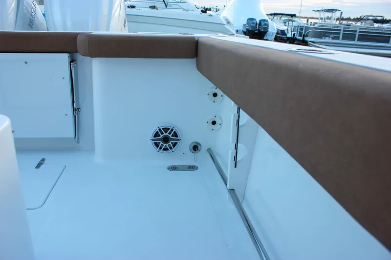 Slide: The Image of 2026 Sea Hunt Gamefish 28 Forward Seating boat interior with cushioned seating and speaker. - 66