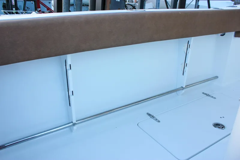 Slide: The Image of 2026 Sea Hunt Gamefish 28 Forward Seating interior detail with cushioned seating and storage. - 67