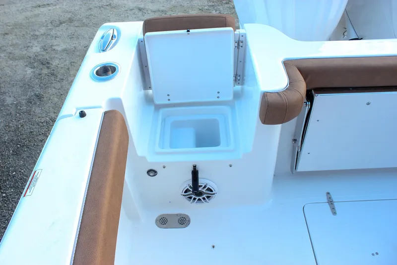 Slide: The Image of 2026 Sea Hunt Gamefish 28 Forward Seating boat interior with storage compartment and cushioned seating. - 7