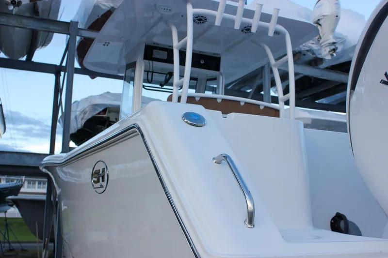 Slide: The Image of 2026 Sea Hunt Gamefish 28 Forward Seating boat, sleek design, docked in marina. - 73